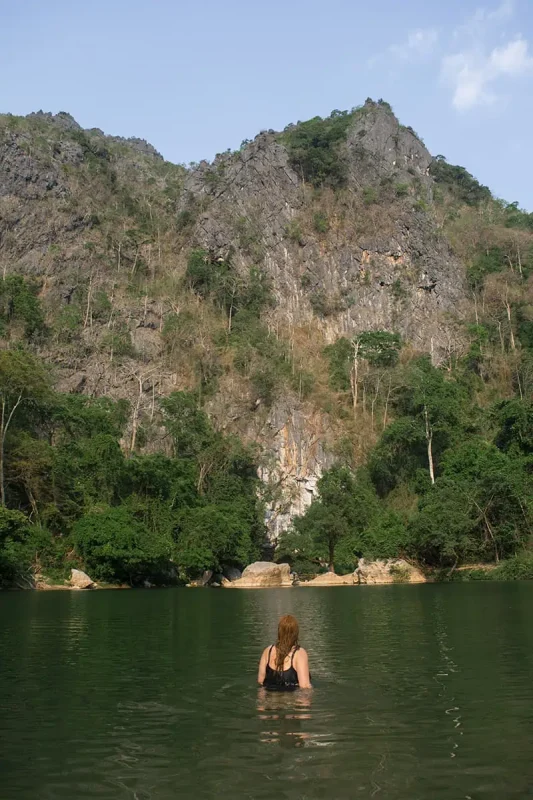22+ Cheapest Countries To Backpack In The World! (2025) 4 tasha amy is swimming in the water near kong lor cave in laos