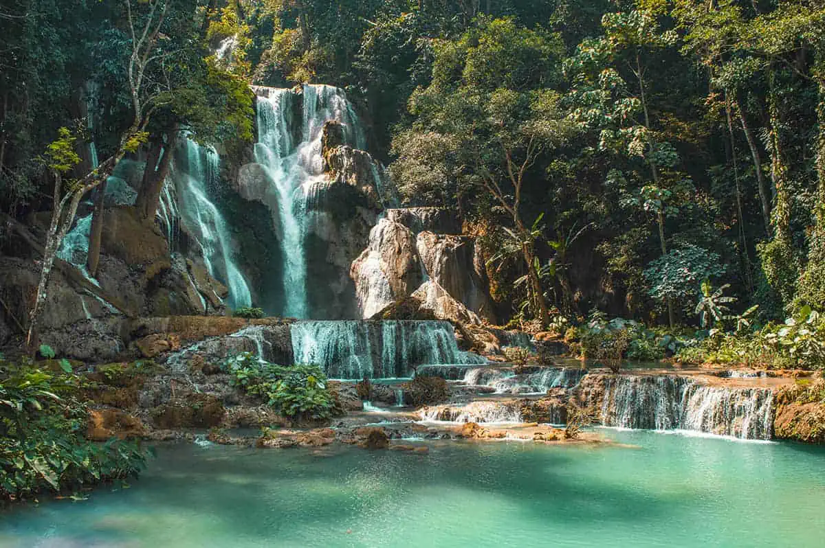 22+ Cheapest Countries To Backpack In The World! (2025) 6 A hidden waterfall called kuang si falls nestled within a lush jungle