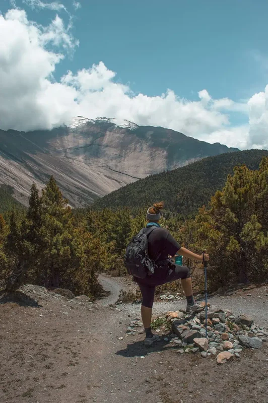 22+ Cheapest Countries To Backpack In The World! (2025) 8 tasha amy looking out to the mountains in the annapurna circuit in nepal