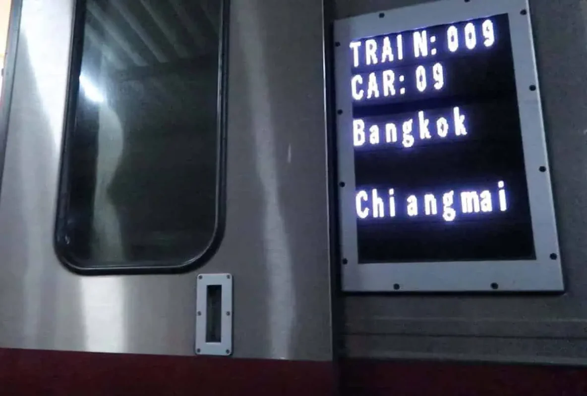 Sleeper Train Bangkok to Chiang Mai: BEST Tips 2025 6 Passengers boarding Train Number 9 for the Bangkok to Chiang Mai overnight sleeper train, showcasing its exterior.