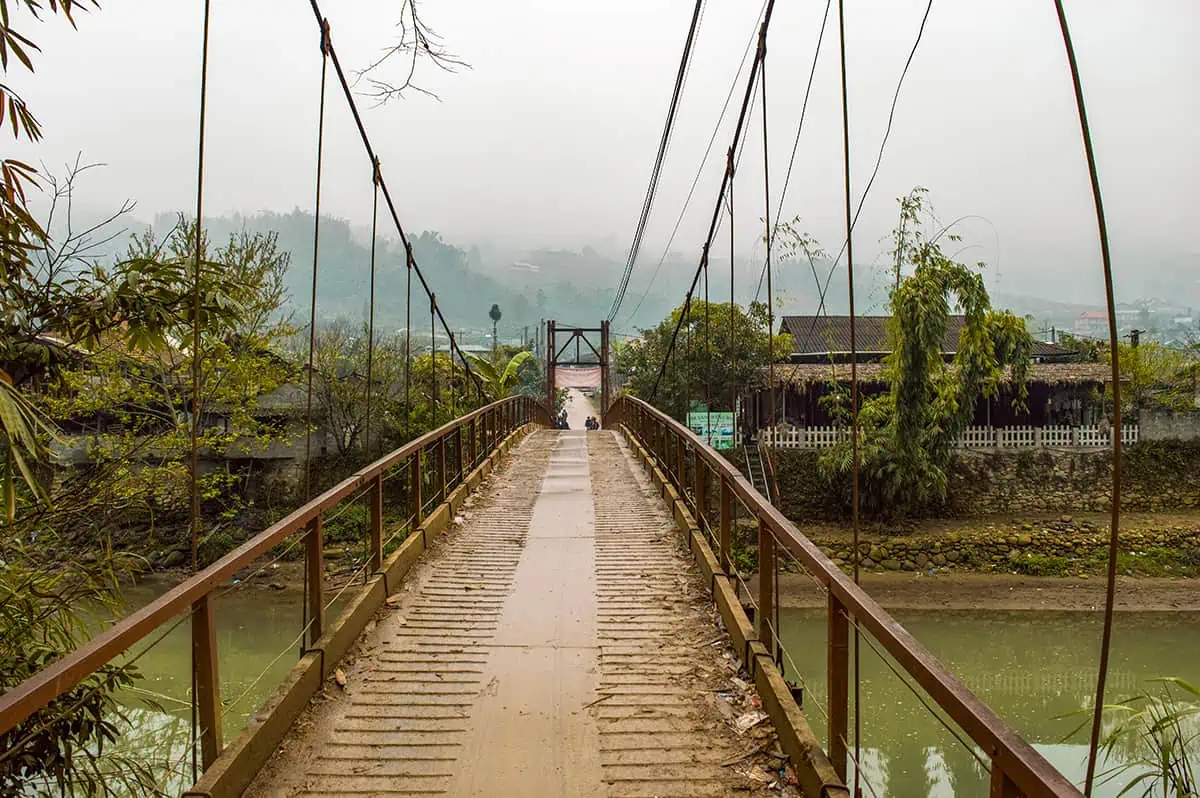 Sapa In February: All You Need To Know (2025) 18 walking over the main bridge into ta van vietnam