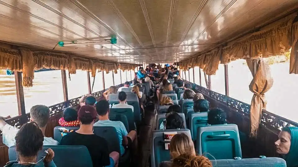 Taking The Slow Boat To Luang Prabang: BEST Tips 2025 17 Passengers seated inside the slow boat to Luang Prabang