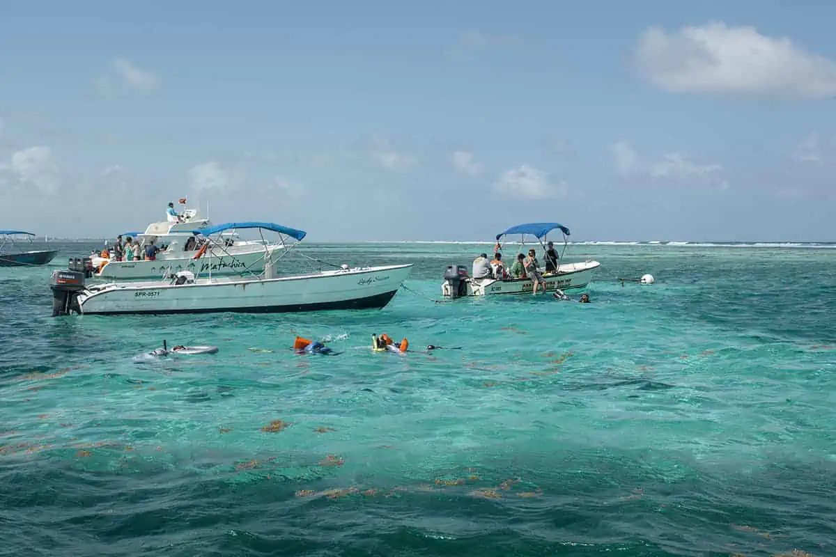 Caye Caulker Snorkeling Tours: Discover The Ultimate Underwater Paradise 7 lots of boats carrying tourists on snorkeling tours in belize