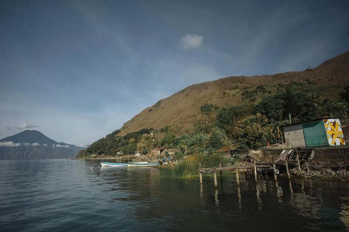 Panajachel To San Pedro & The Towns Between: How To Travel Around Lake Atitlan 38 traveling around lake atitlan by water taxi pulling in to free cerevza hostel