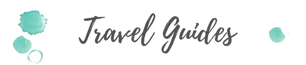 home page travel guide header for backpackers wanderlust with blue watercolor marks on each side