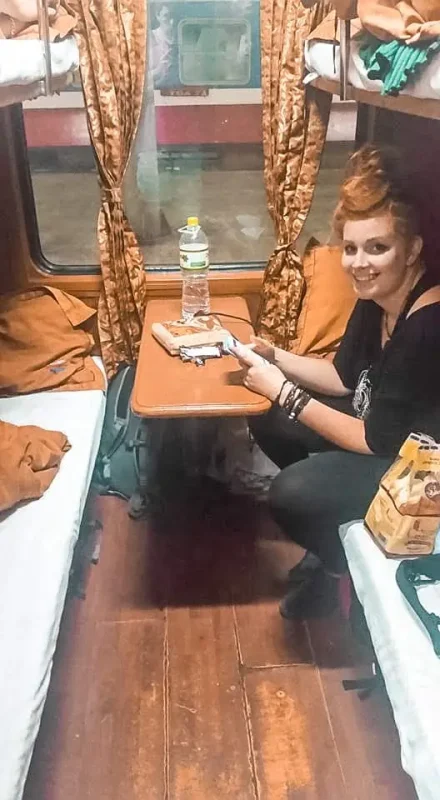 Hanoi To Sapa: Travel By Train, Bus, Or Taxi (2025) 6 tasha amy enjoys the comfort of a first-class sleeper train compartment in Vietnam
