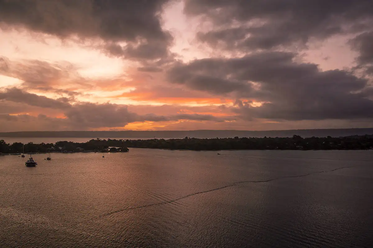 Vila Vanuatu Cruise Port: What To Know And Best Things To Do 10 the sunset sky starting to change to pink hues while we cruise past small islands as we leave port vila vanuatu