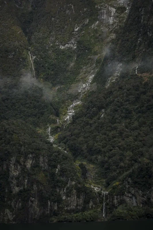 Best Waterfalls In Milford Sound Worth Checking Out 14 Multiple thin waterfalls stream down the face of a steep mountain in Milford Sound.