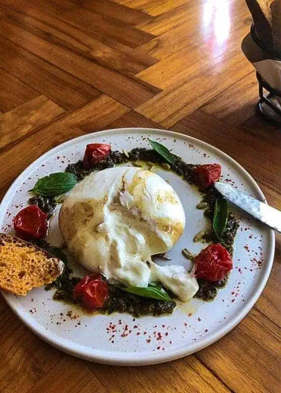 Where To Eat In Luang Prabang: 12 BEST Restaurants 2025 17 fresh burrata surrounded by pesto and tomato's from popolo luang prabang