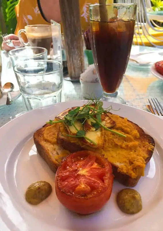 Where To Eat In Rarotonga: BEST Restaurants & Cafes 2025 16 Savory breakfast toast with scrambled eggs and a side of roasted tomato, capturing the essence of lazy trout for a morning meal.