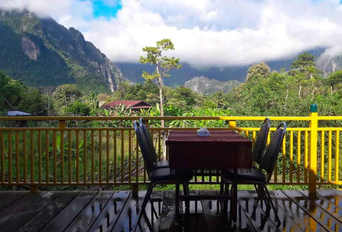 Where To Eat In Vang Vieng: BEST 11 Spots Worth Trying 9 incredible views out to the limestone mountains from green restaurant in vang vieng