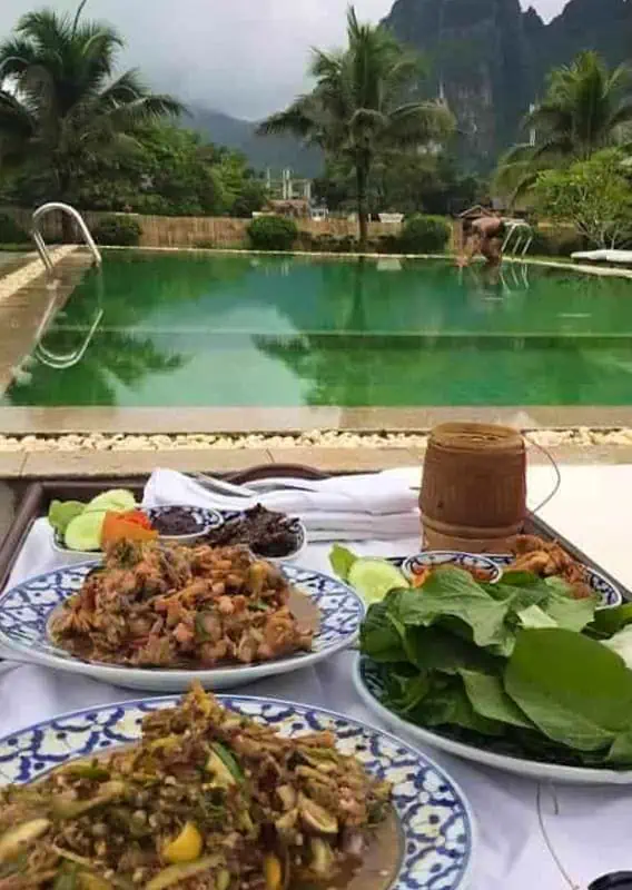 Where To Eat In Vang Vieng: BEST 11 Spots Worth Trying 6 lunch by the poolside at restaurant du crabe d'or where to eat lunch in vang vieng