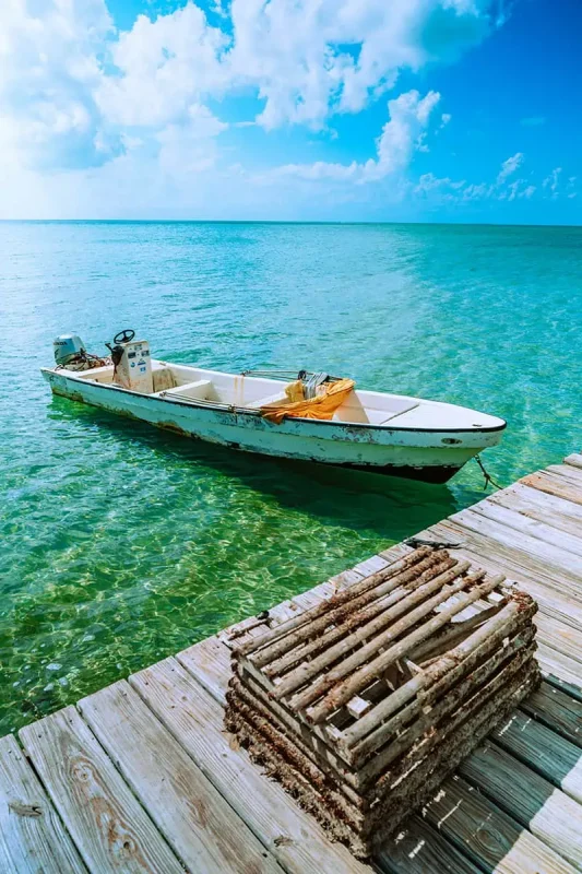 Why Visit Belize: 20 Reasons To Add It To Your Travel Bucketlist 19 a local fishing boat waiting at the pier in san pedro